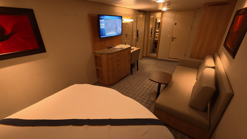Celebrity Solstice Inside Cabin 7160 showing the entryway, vanity, closet, and storage area.
