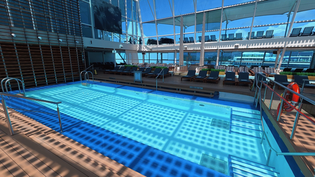 Adults-only Solarium aboard Celebrity Solstice featuring the indoor pool and lounge chairs.