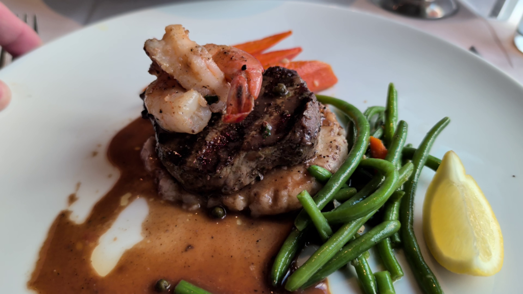 Filet mignon topped with shrimp served for the final dinner in the Grand Epernay Restaurant aboard Celebrity Solstice.