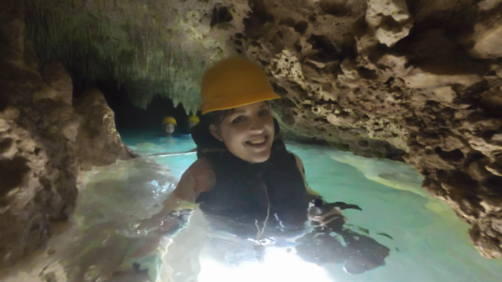 Andrea wading through the underground waters inside the Chaak Tun Caverns near Playa del Carmen, Mexico.