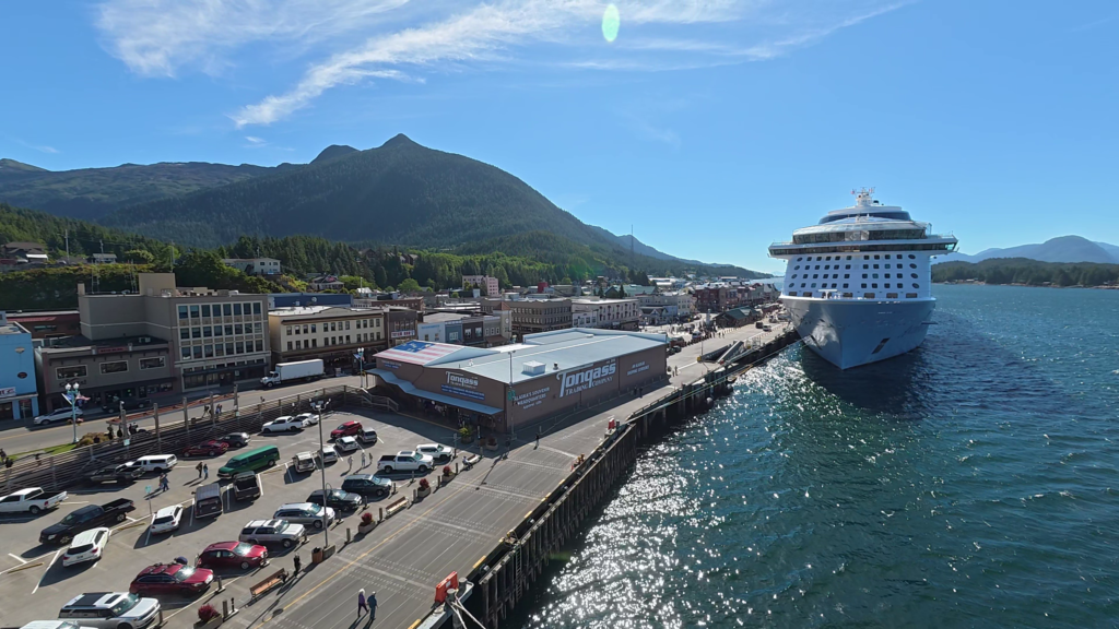 Downtown Ketchikan, Alaska with Anthem of the Seas docked at the cruise port on a sunny day.