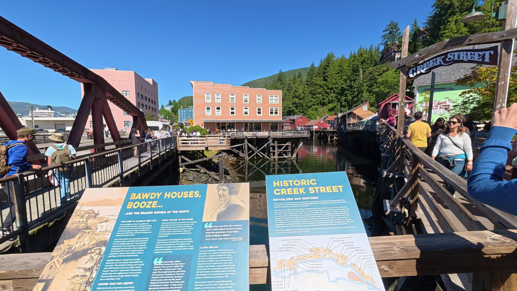 Historic Creek Street boardwalk in Ketchikan, Alaska on a sunny day.