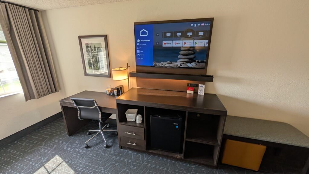 Television and desk area inside our Ramada Spokane Airport guest room.