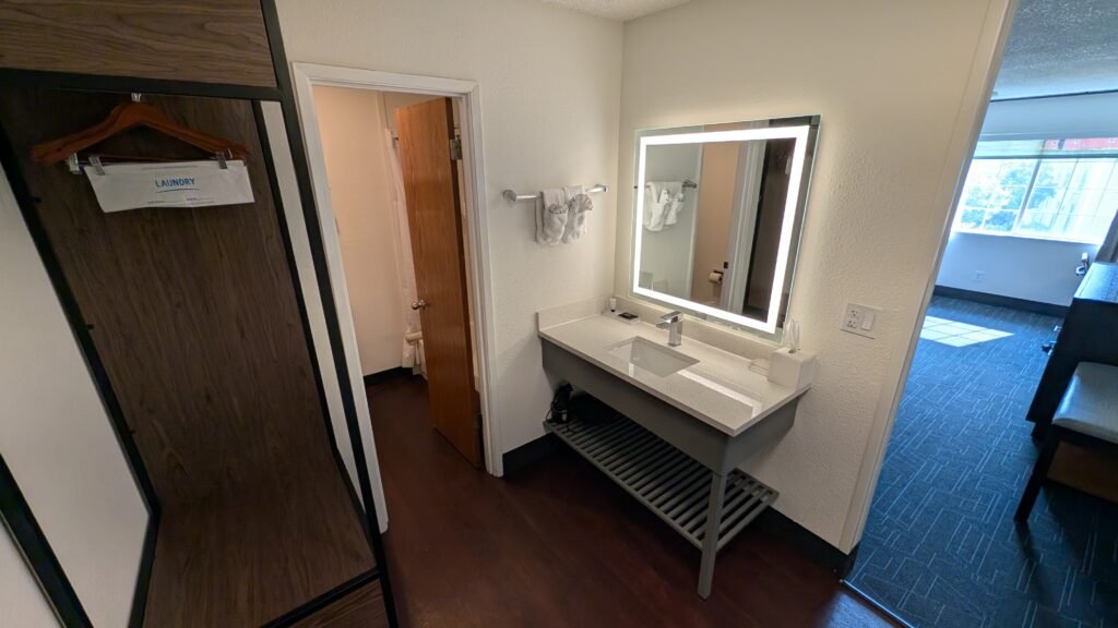 Bathroom vanity with sink and mirror at Ramada by Wyndham Spokane Airport.