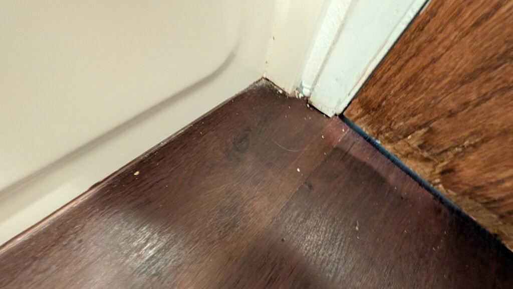 Visible wear and aging around the bathtub in our Ramada Spokane Airport bathroom.