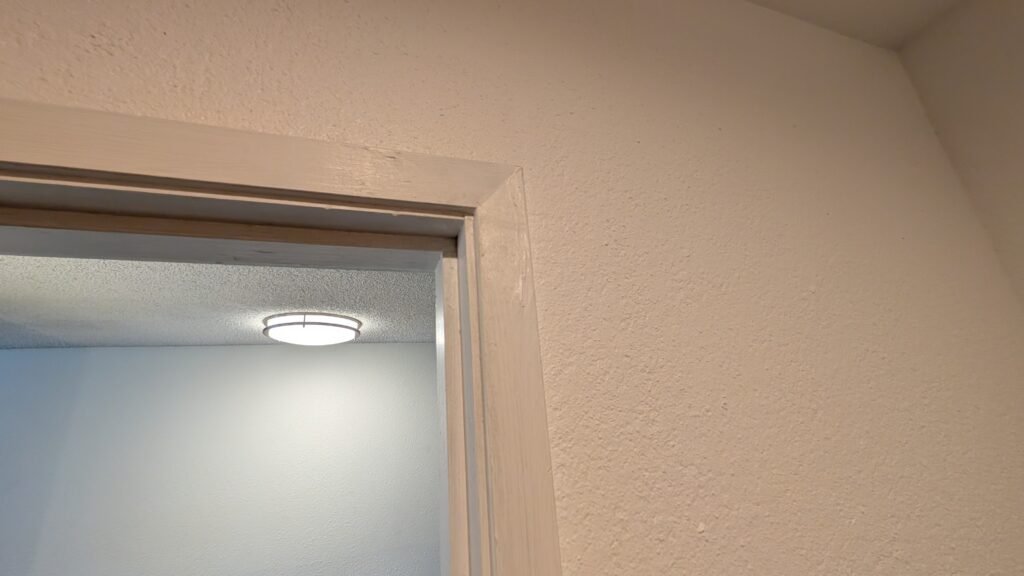 Worn bathroom trim and molding inside our Ramada Spokane Airport guest room.