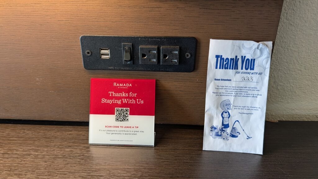 Electrical outlets and USB charging ports in the desk and TV area at Ramada Spokane Airport.