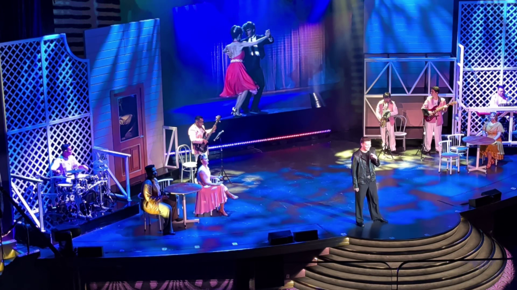 Dirty Dancing in Concert aboard MSC Poesia with the movie playing behind the live performers